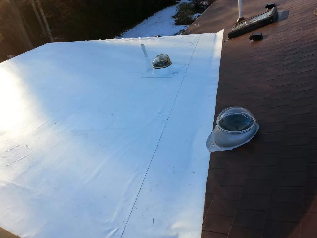 Aluminum shingles and PVC roof installation by roofers Needham