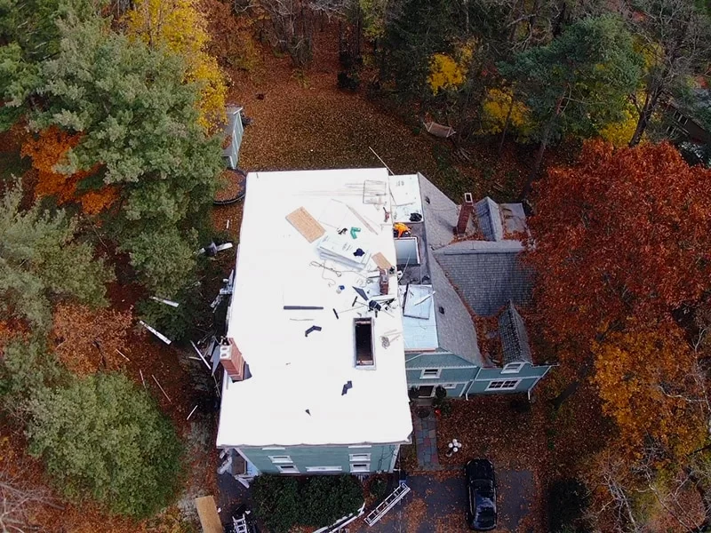 Professional Roofing Contractor on the flat roof