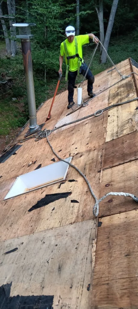 Preparing a pitched roof - openings for skylights are visible