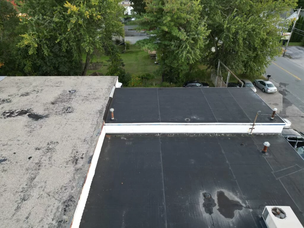 Close-up of black membrane roofing at 155 Thompson Rd Webster