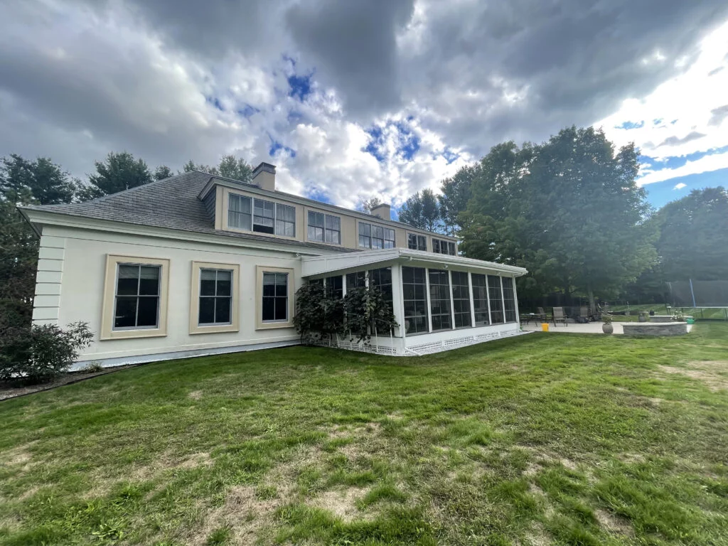Backyard view of the new 3-season porch addition