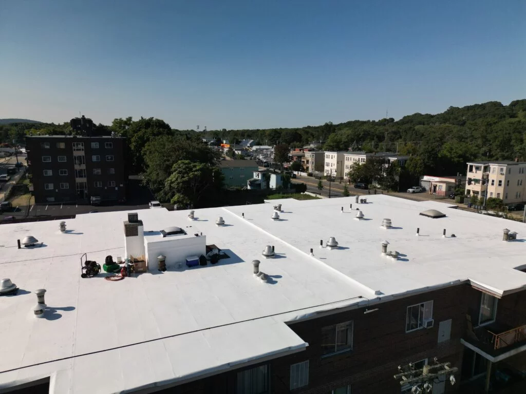 Close-up of 60 mil PVC being professionally installed at 790 Hyde Park Ave, Boston, MA