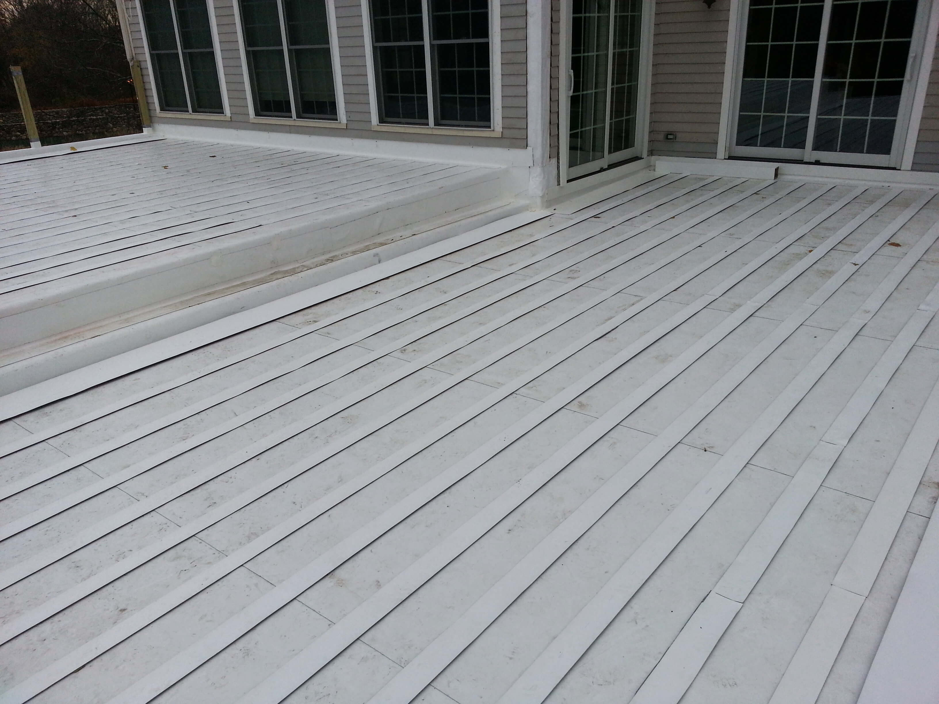 PVC Roof Installation Under Floating Wooden Deck in Sudbury, MA