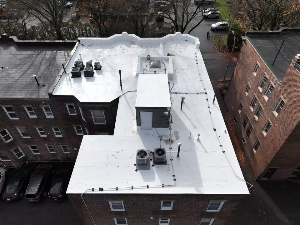 Apartment building, Brookline, MA — white reflective roof membrane