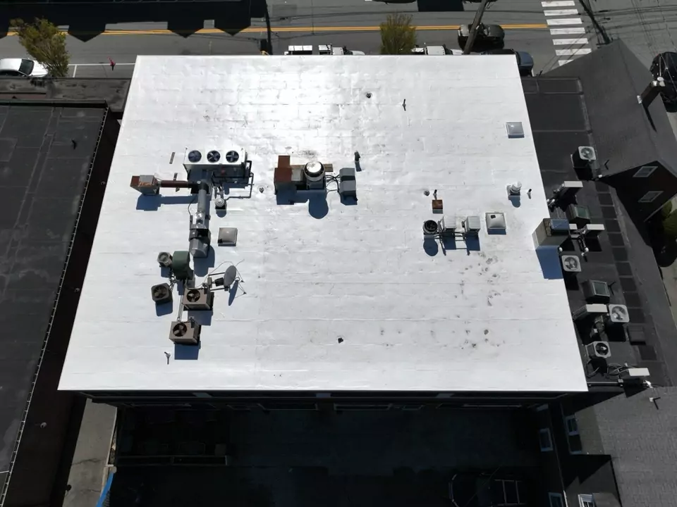 Mixed-use commercial building, Lexington, MA — white reflective roof membrane