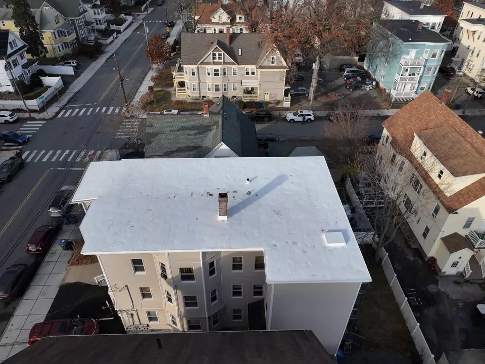 Multi-family building, Lawrence, MA — white reflective roof membrane